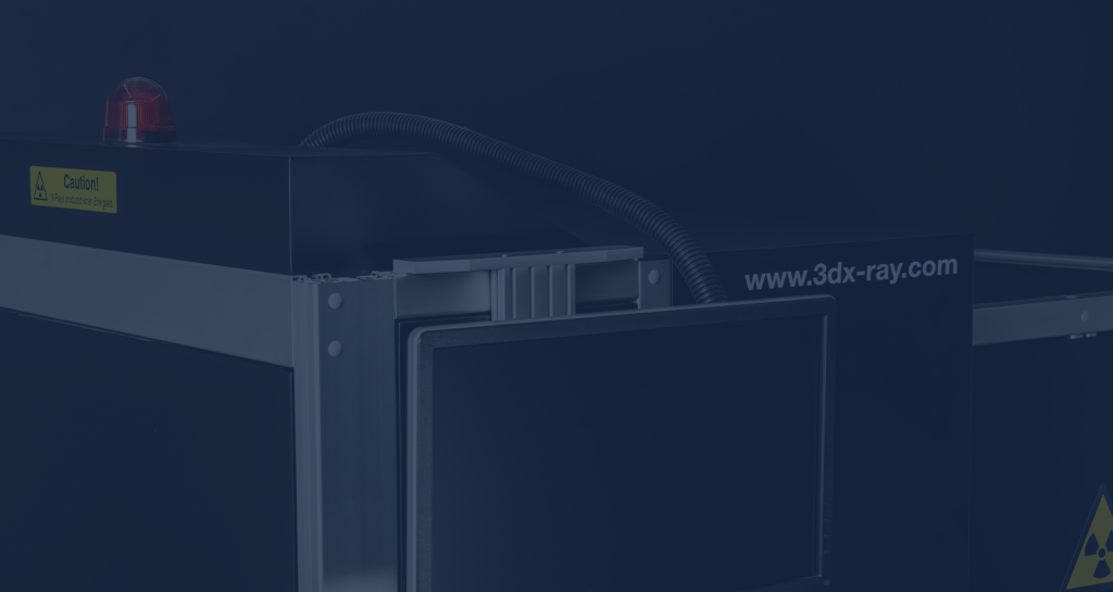 Close-up of a 3DX-RAY X-ray screening system showing the inspection opening, detector panel, and conveyor housing.