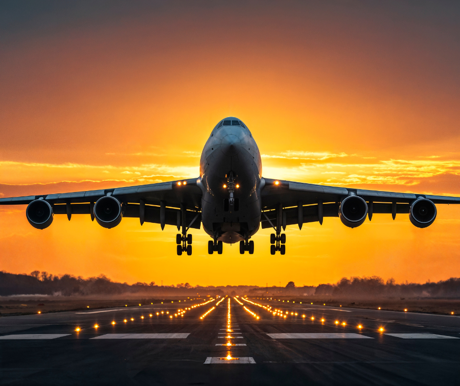 Commercial aircraft taking off at sunset, representing the aviation industry's demand for advanced x-ray screening solutions in airport security and cargo inspection.