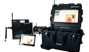 Portable X-ray inspection system with rugged case, control screen, detector panel, and tablet displaying scan imagery.