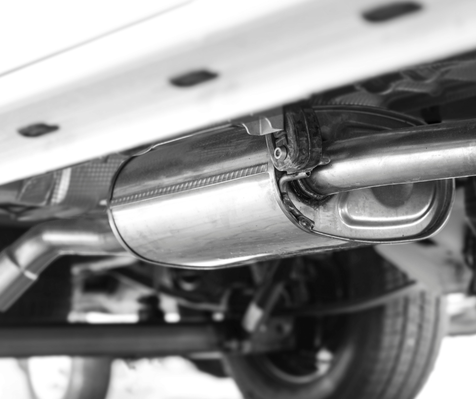 Close-up of a vehicle's catalytic converter and exhaust system, highlighting components subject to catalytic converter quality control.